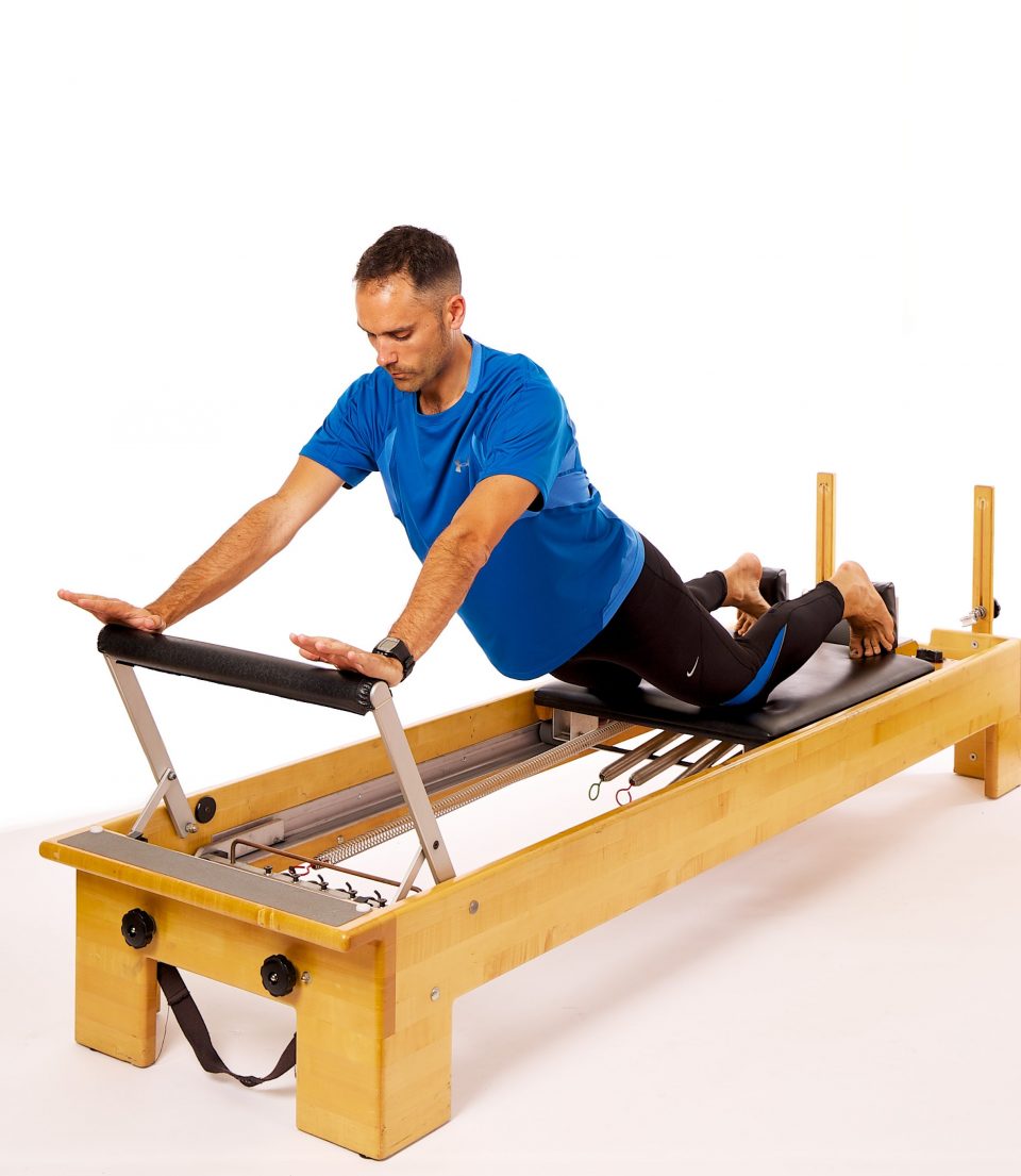 reformer down-stretch progression balance exercise